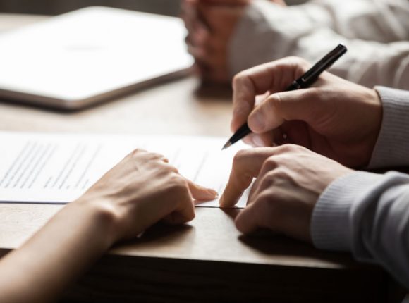 Pointing At Paper during loan signing