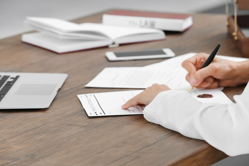 Women Signing Paper